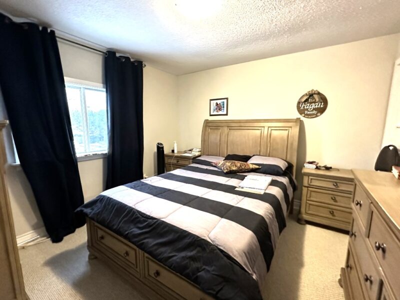Cozy bedroom in lower unit of duplex
