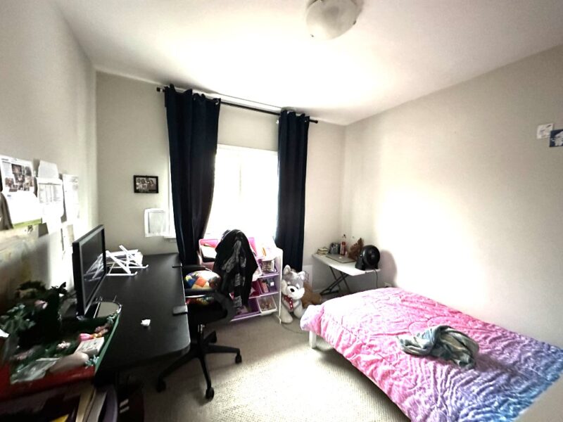 Cozy bedroom in lower unit of duplex