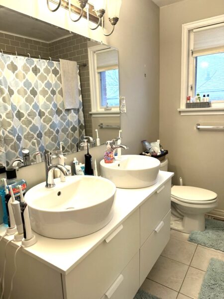 Modern bathroom with tiled shower and vanity