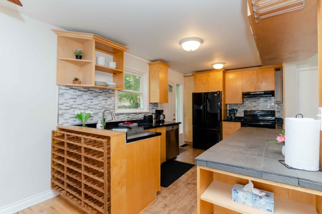 Full kitchen in the lower unit with modern cabinetry