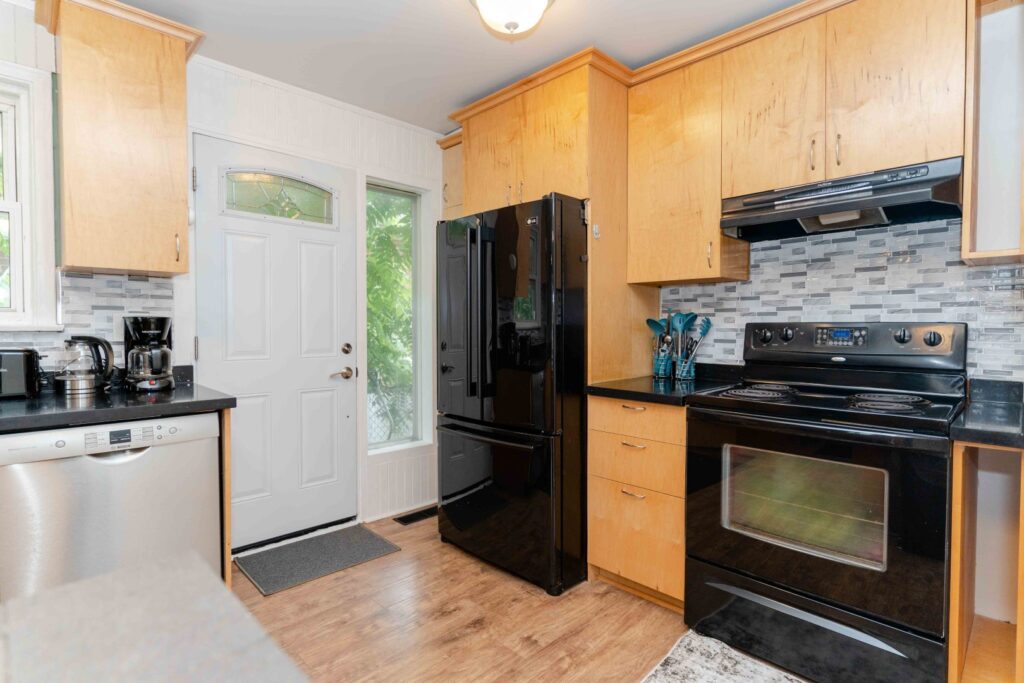 Full kitchen in the lower unit with modern cabinetry