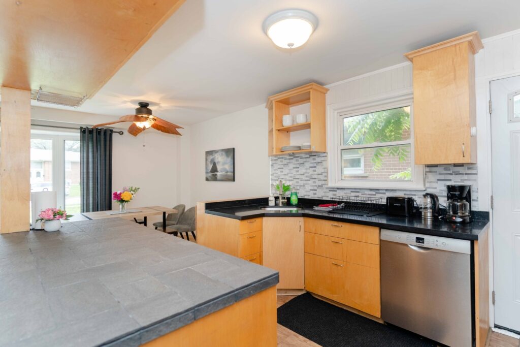 Full kitchen in the lower unit with modern cabinetry