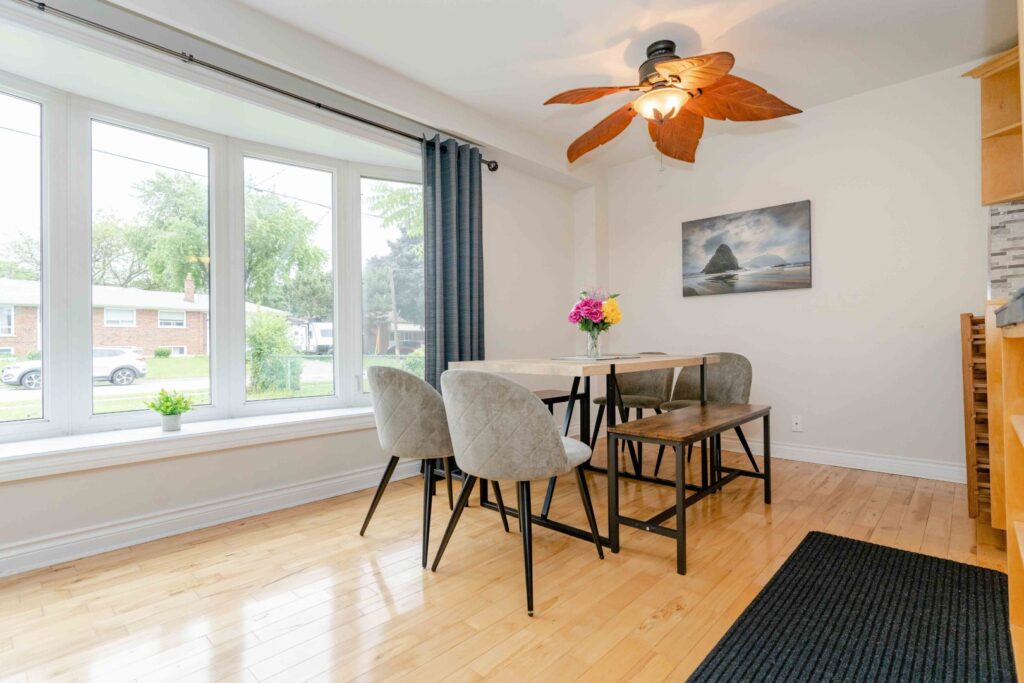 Lower unit hallway and living area with bright lighting