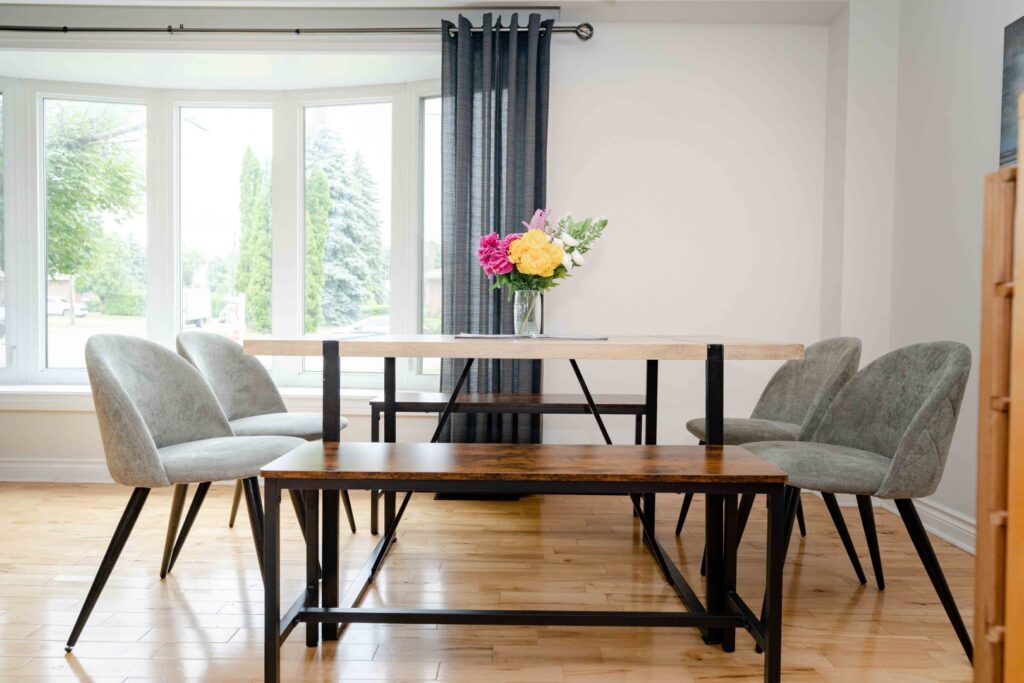 Lower unit hallway and living area with bright lighting