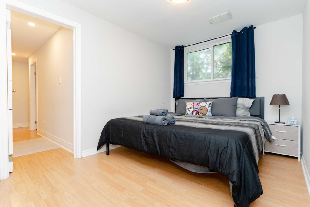 Cozy bedroom in lower unit of duplex