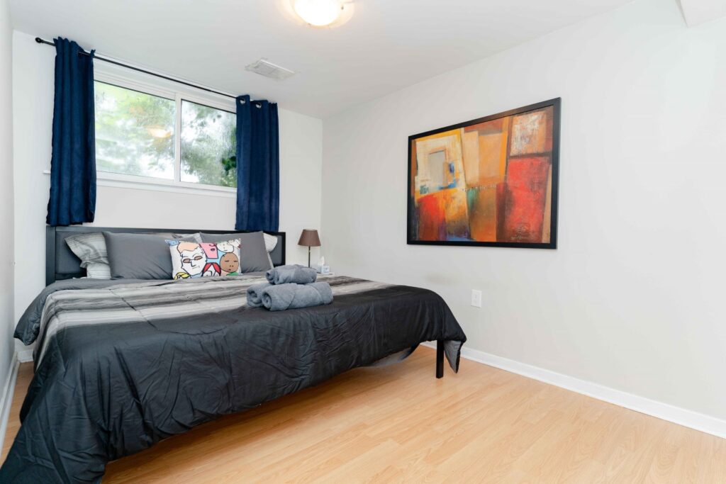 Cozy bedroom in lower unit of duplex
