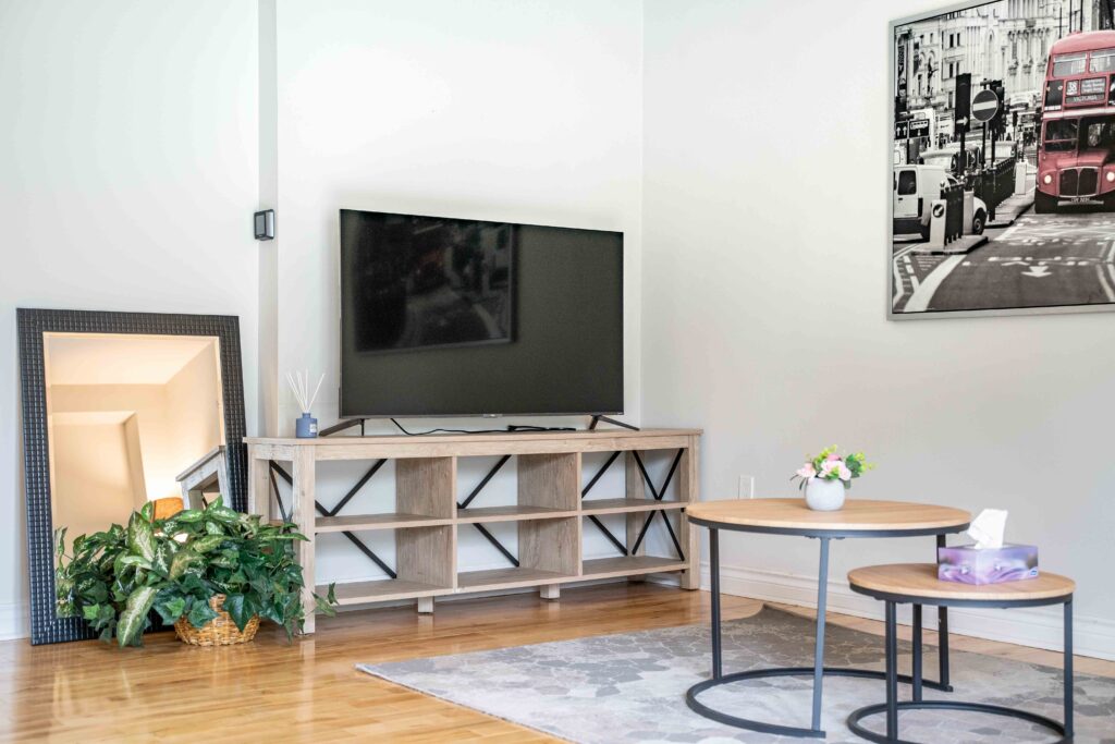 Lower unit hallway and living area with bright lighting