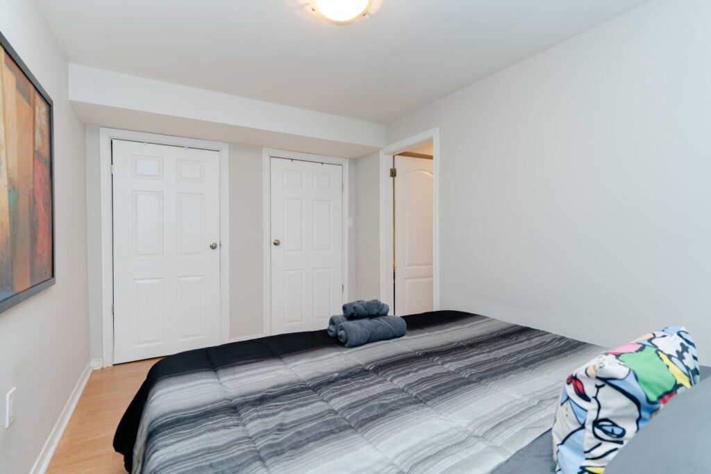 Cozy bedroom in lower unit of duplex